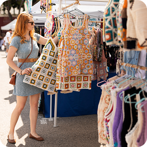 Shopper browsing dresses at Canton Trade Days